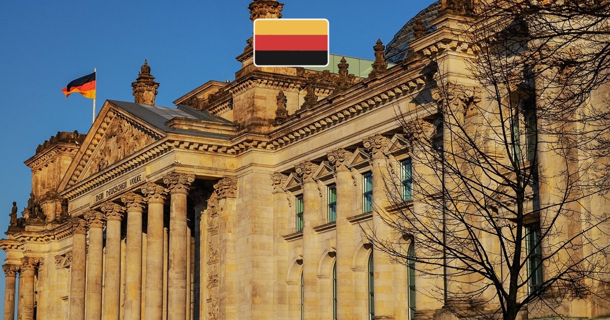 Berlin Reichstag parliament with the German flag flying outside